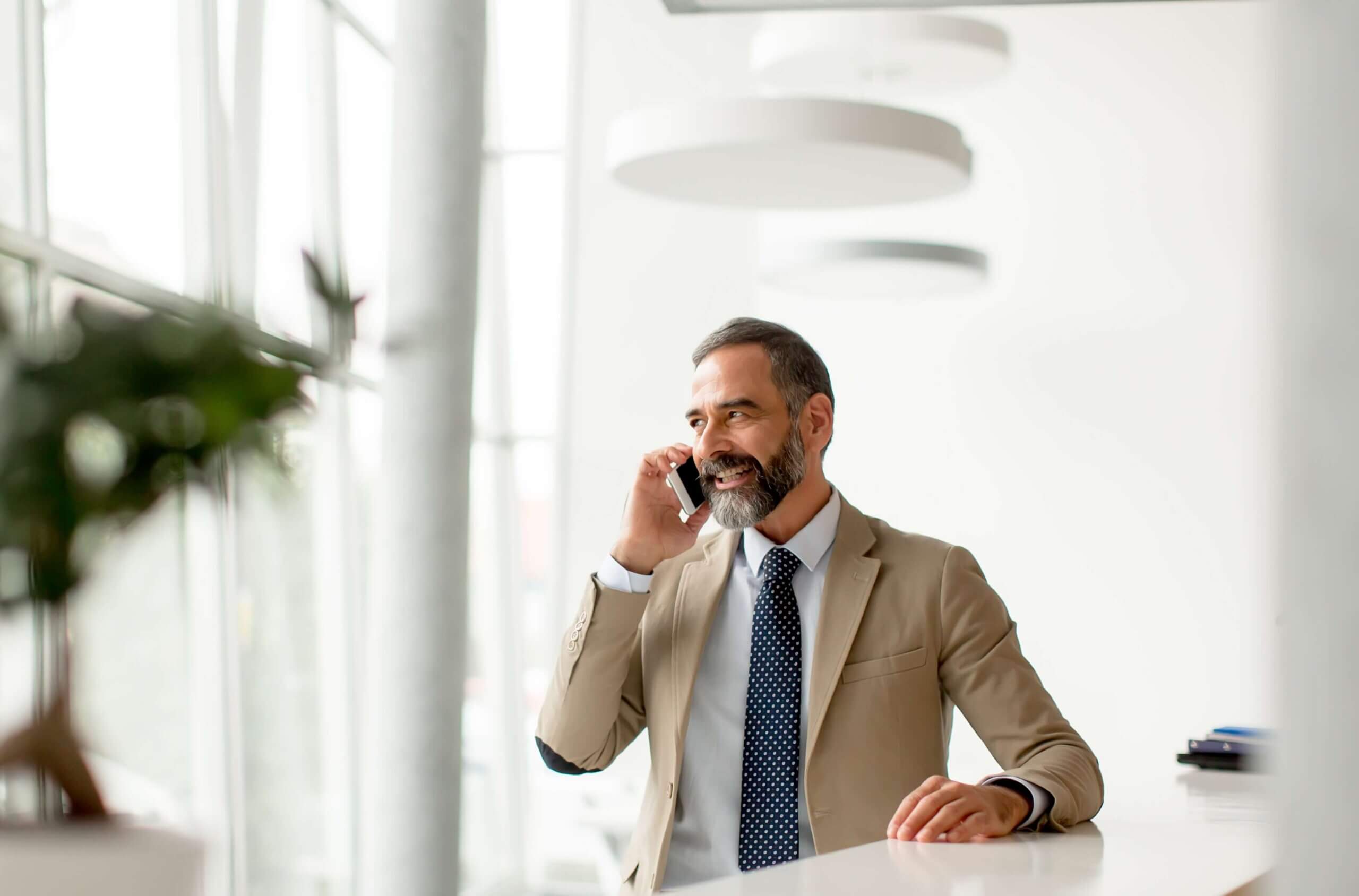 A businessman talking to someone in the phone