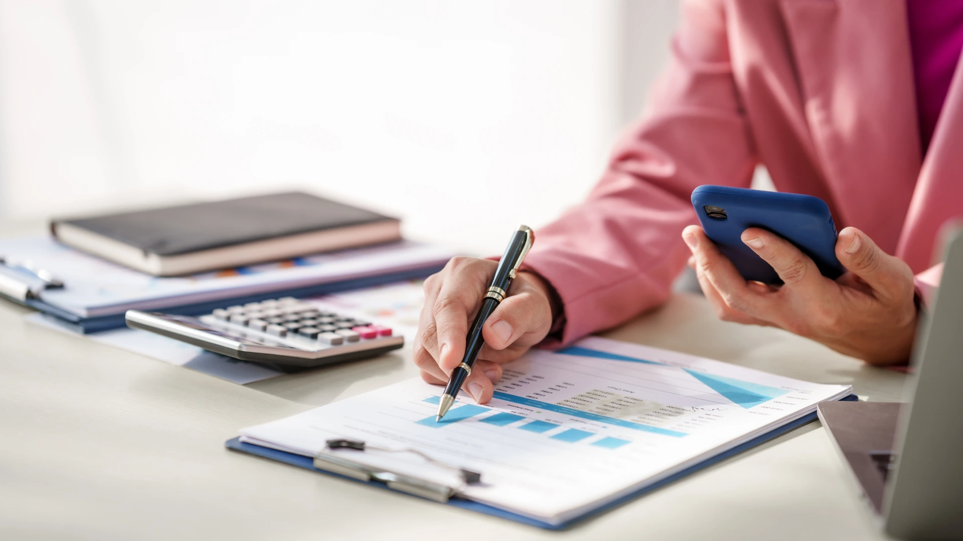 A businesswoman wearing pink suit, business finance, investment strategies, risk management