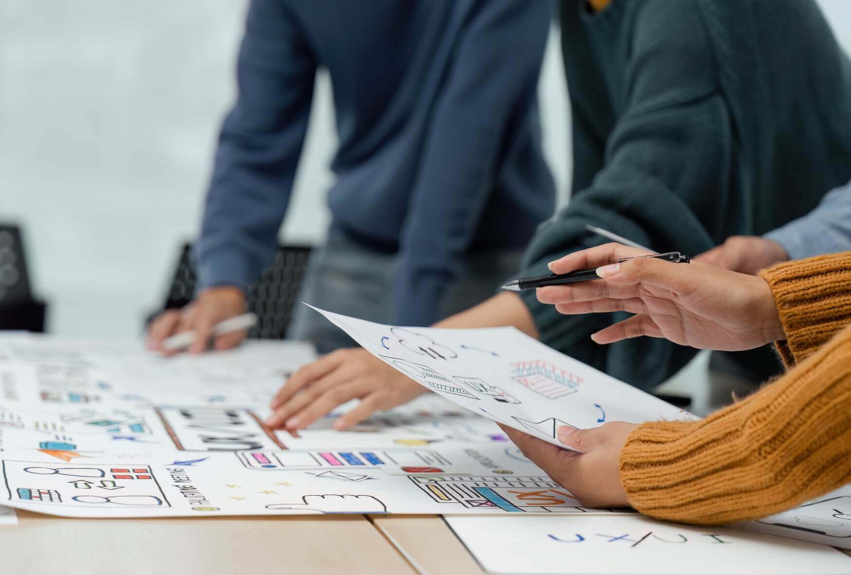 A group of designers choosing color samples for a website