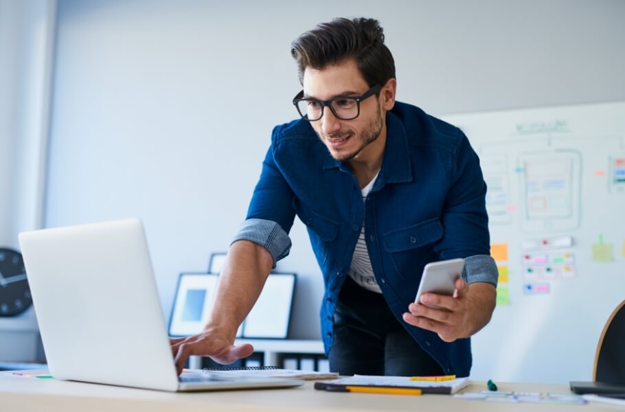 A man checking her laptop