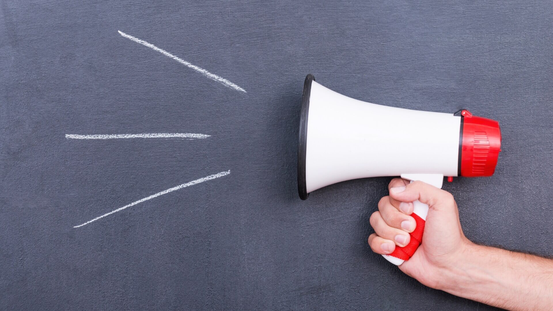 A person handle a red megaphone