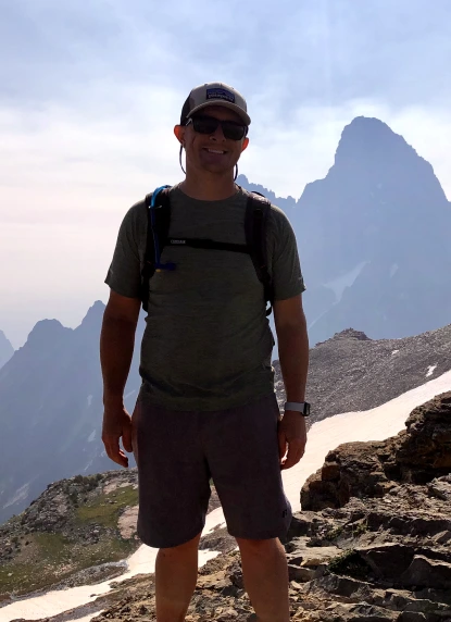 A solo shot of Aaron in a mountain