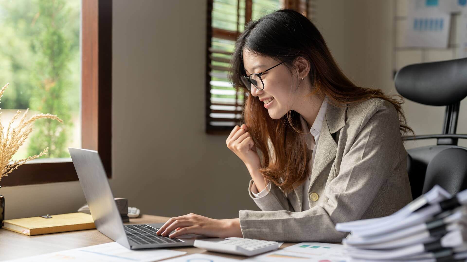 A woman smiling while working