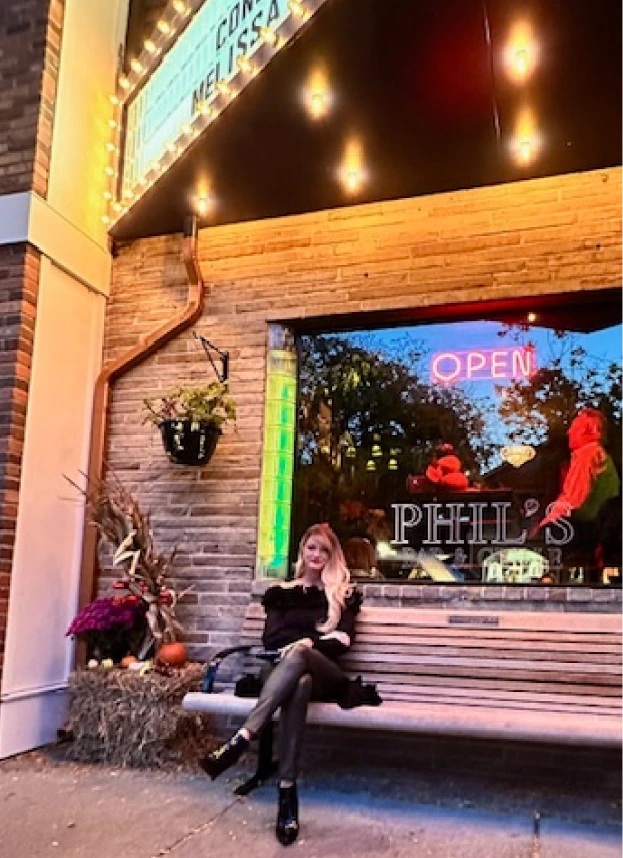 Amy sitting at Phil’s store