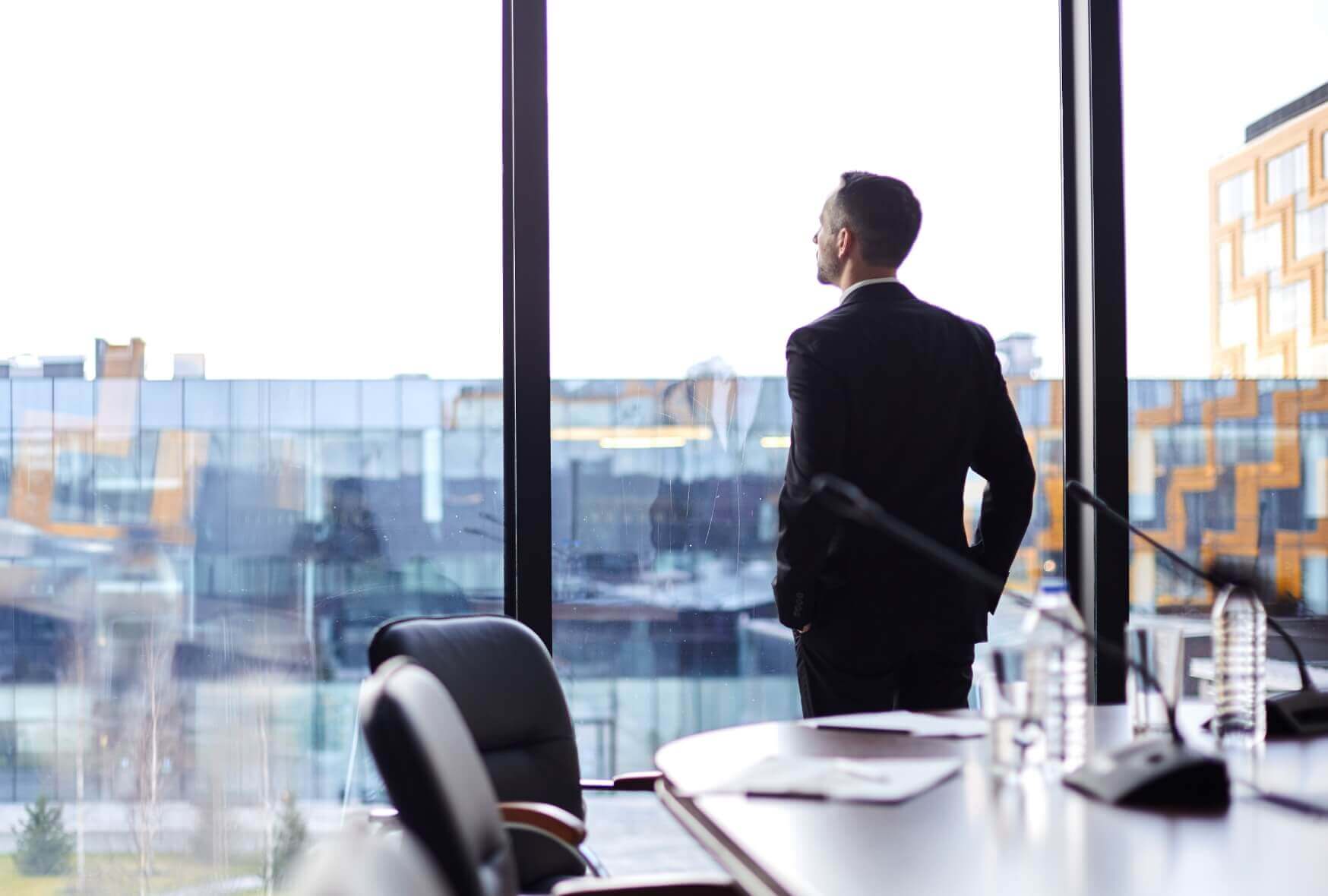 Businessman by window