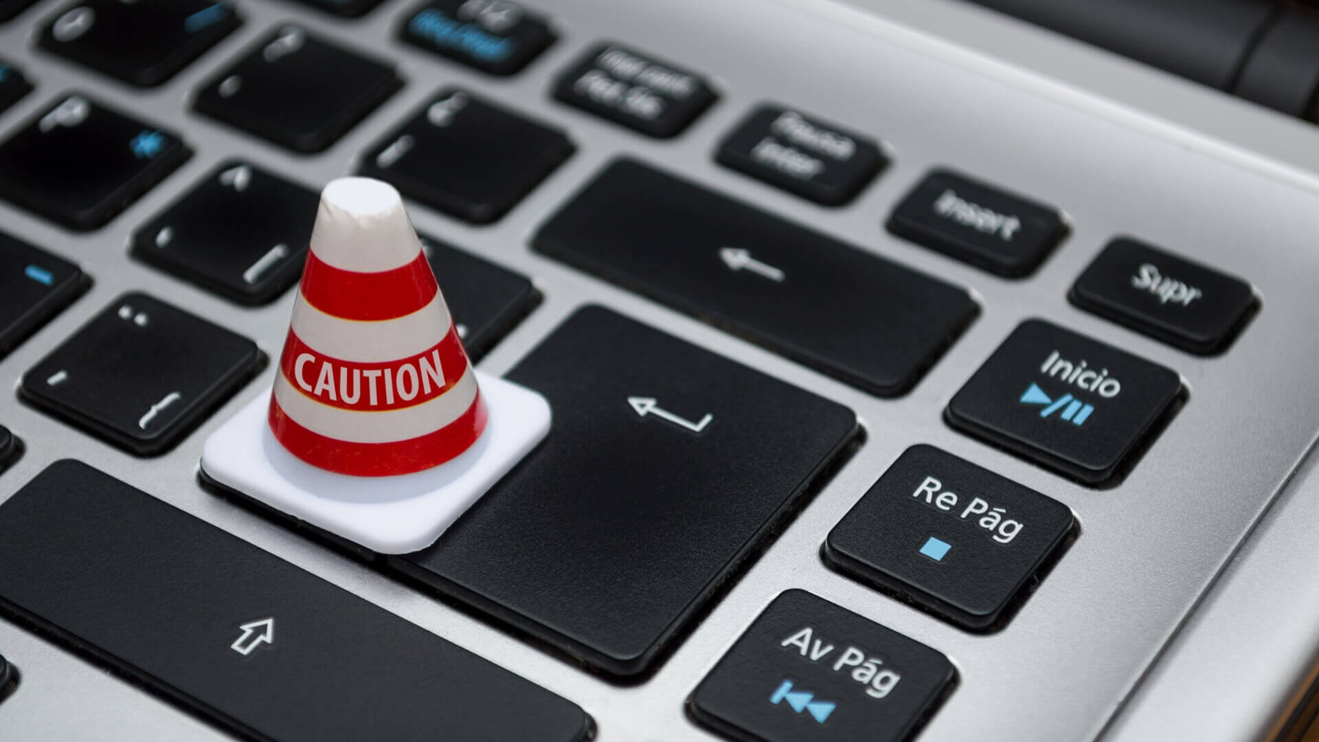 Caution cone above the laptop