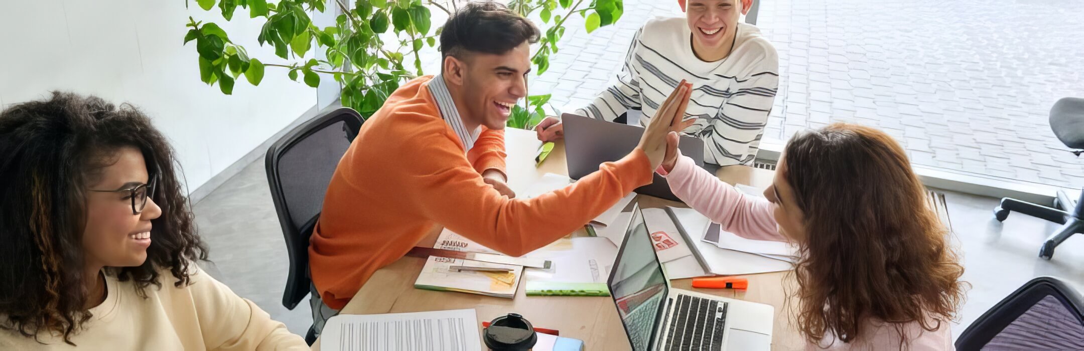 friends happily collaborating on a project