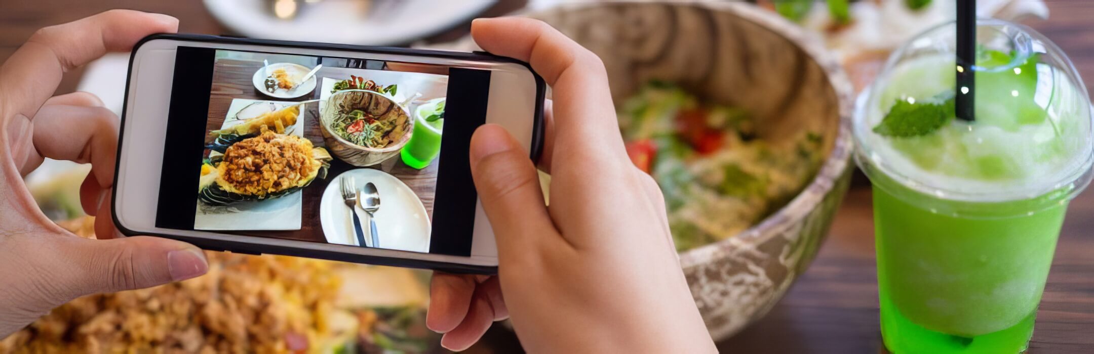 a person taking a picture of her food