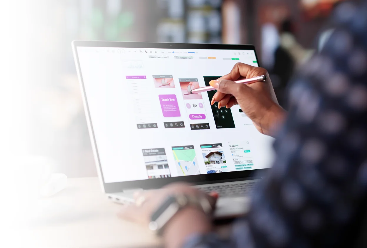 Designer reviewing a website layout on screen
