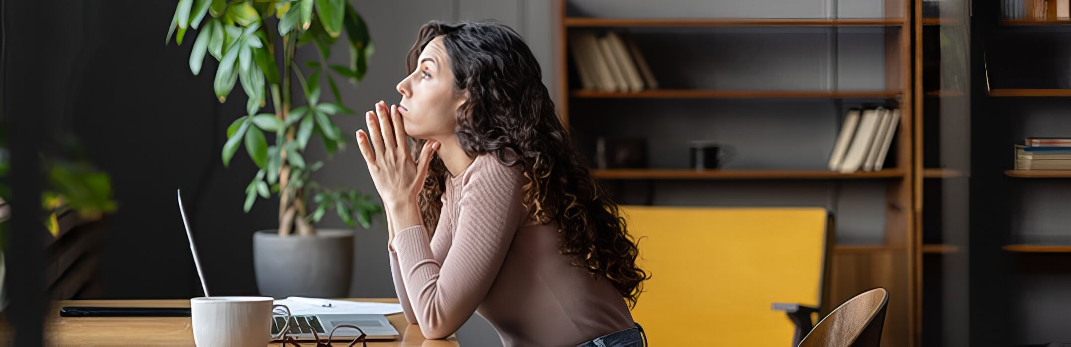 Woman wondering at her computer