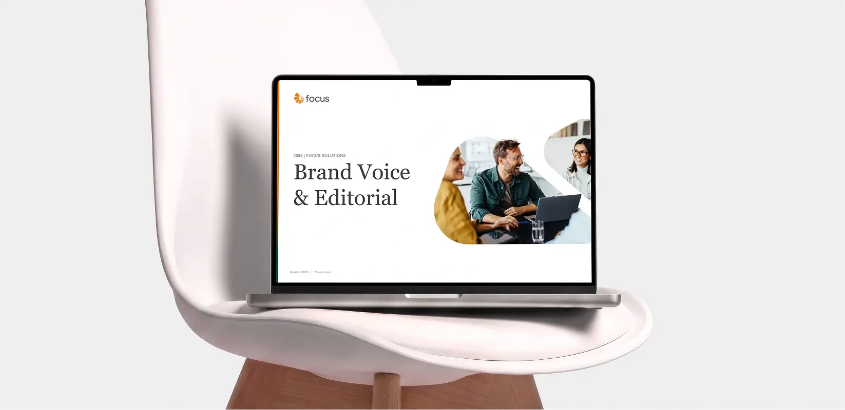 Focus Solution brand voice and editorial guidelines displayed on a laptop mockup