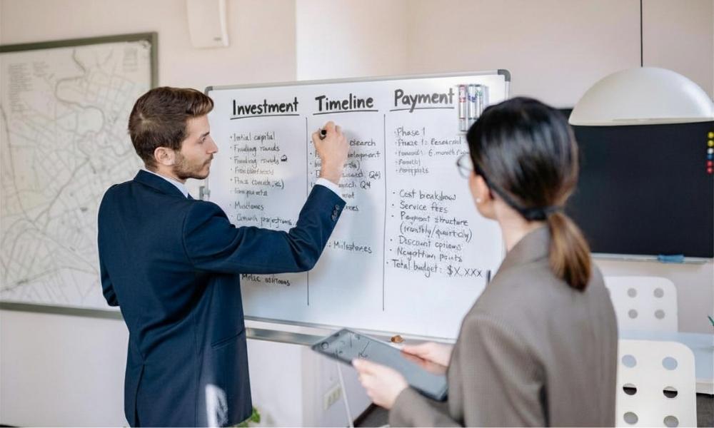 Guy explaining the pricing process of a project