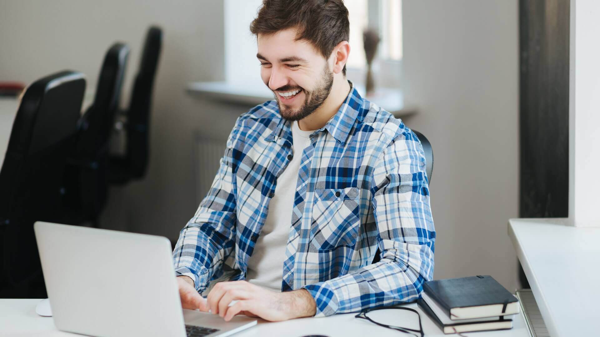 Happy person at front of laptop