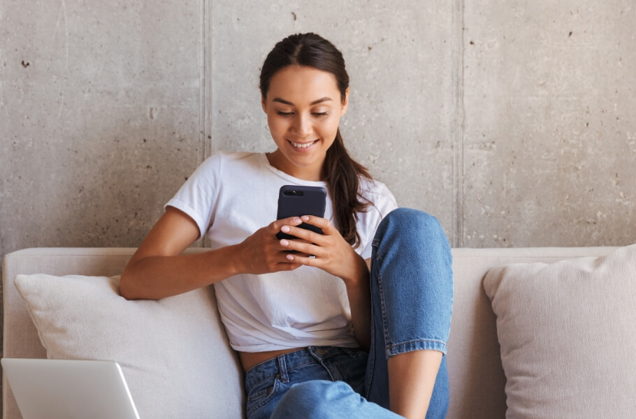 Happy women sitting in a sofa