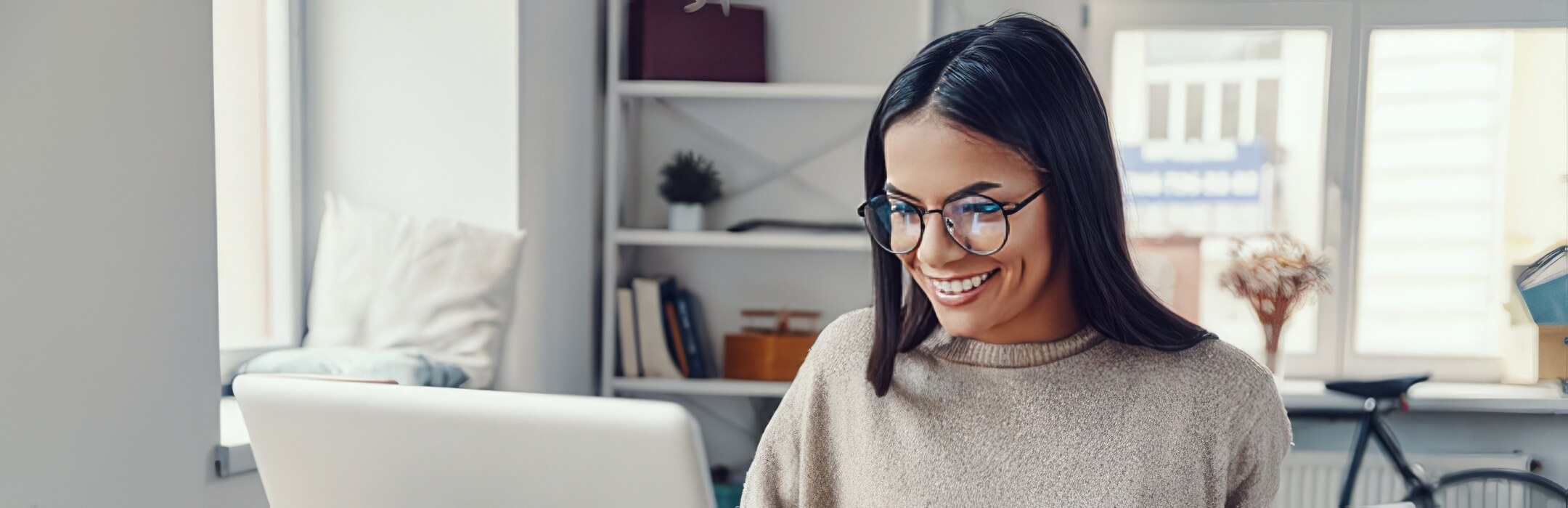 Smiling woman at computer