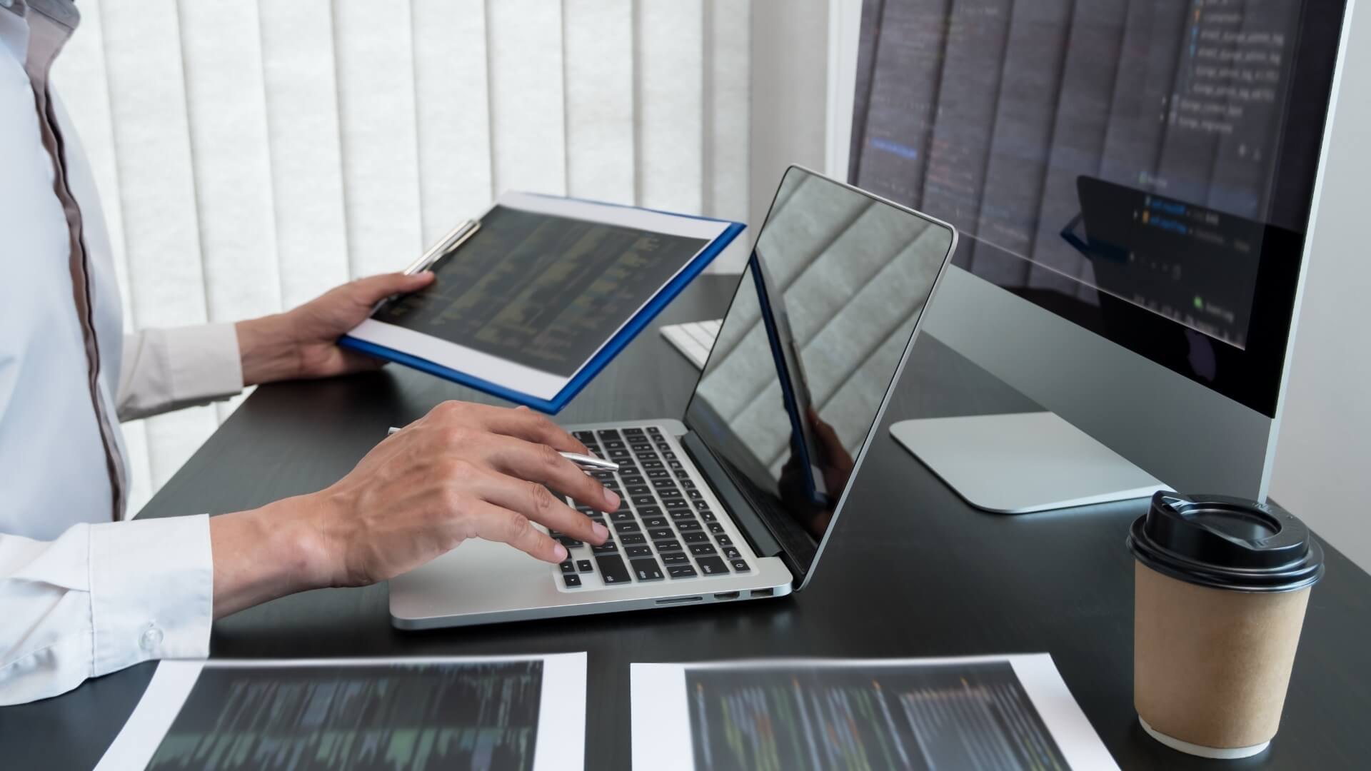 Man using laptop and tablet