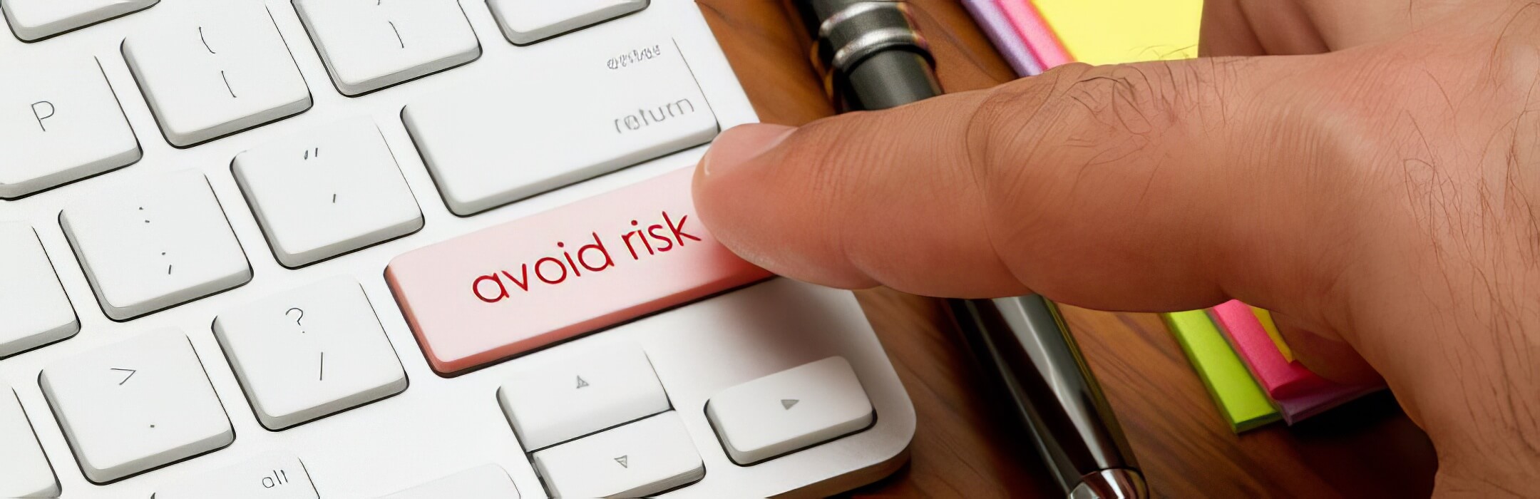 Person clicking avoid risk button