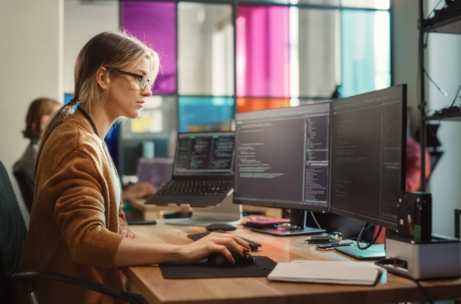 Programmer women focus on her monitor