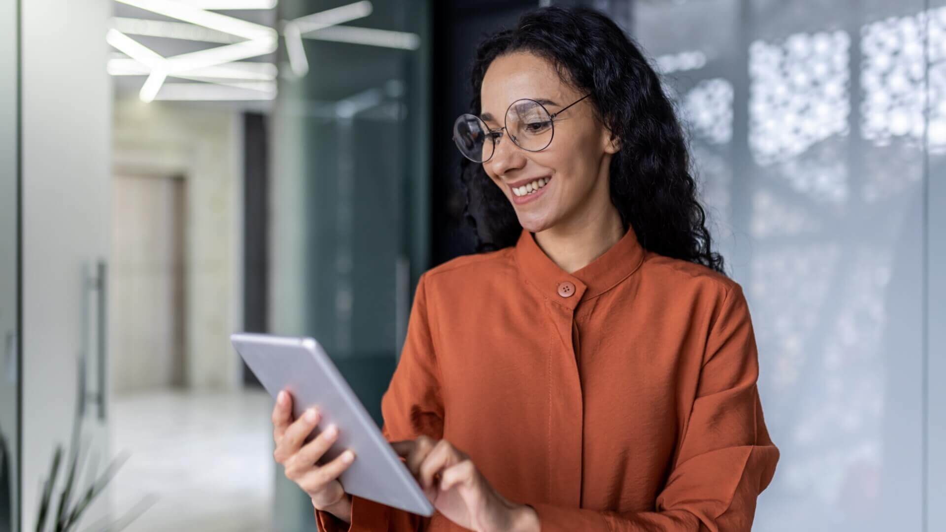 Smiling woman using a tablet