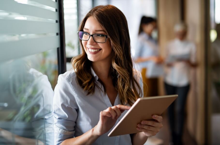 Smiling women while using tablet