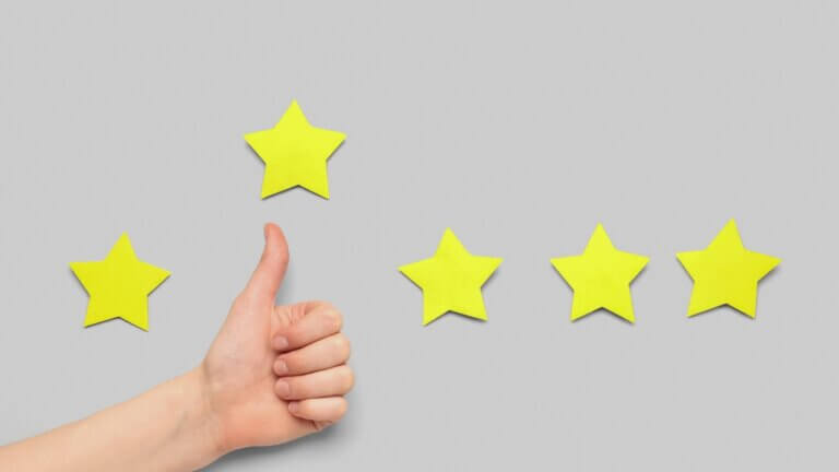 Woman Showing Thumb up and Five Stars