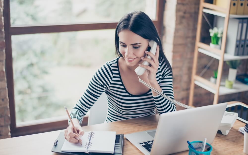 Women taking notes to the client says