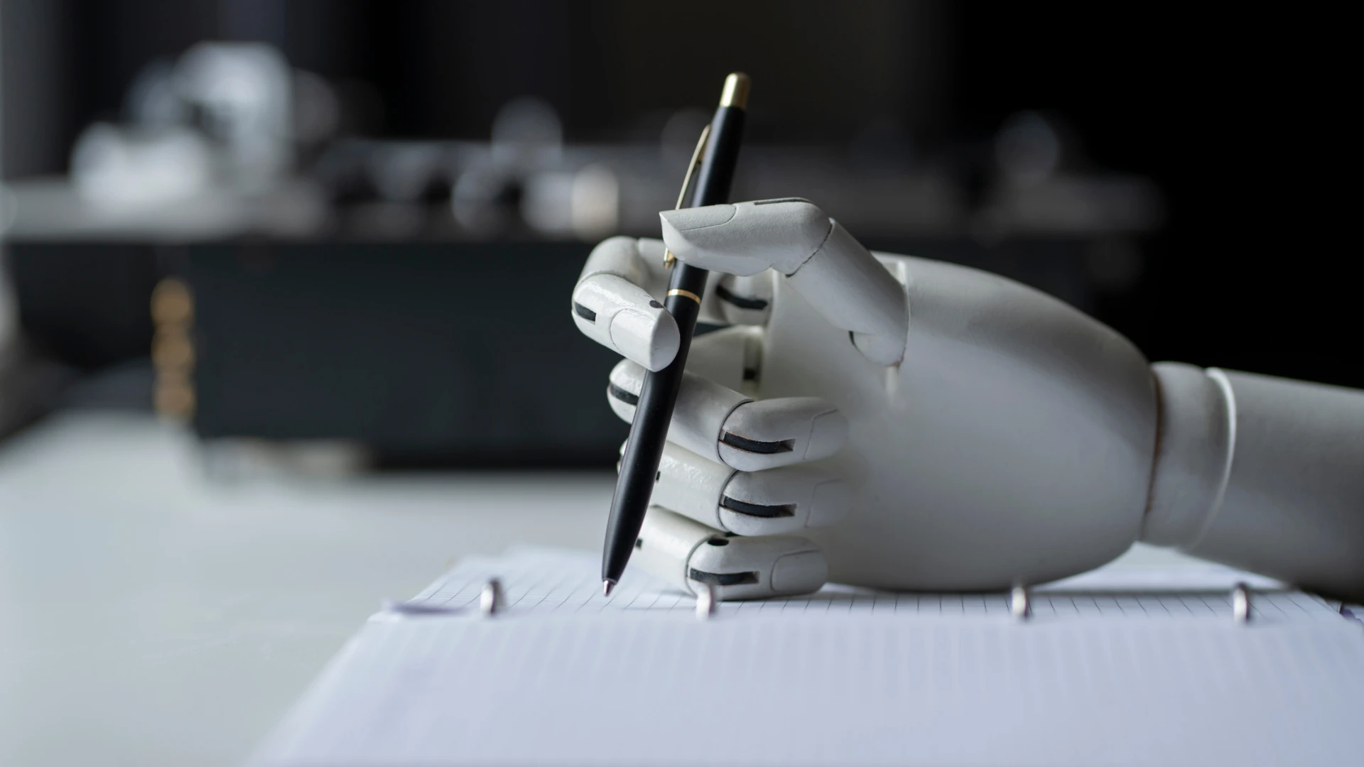 Artificial robotic arm write down some notes with pen