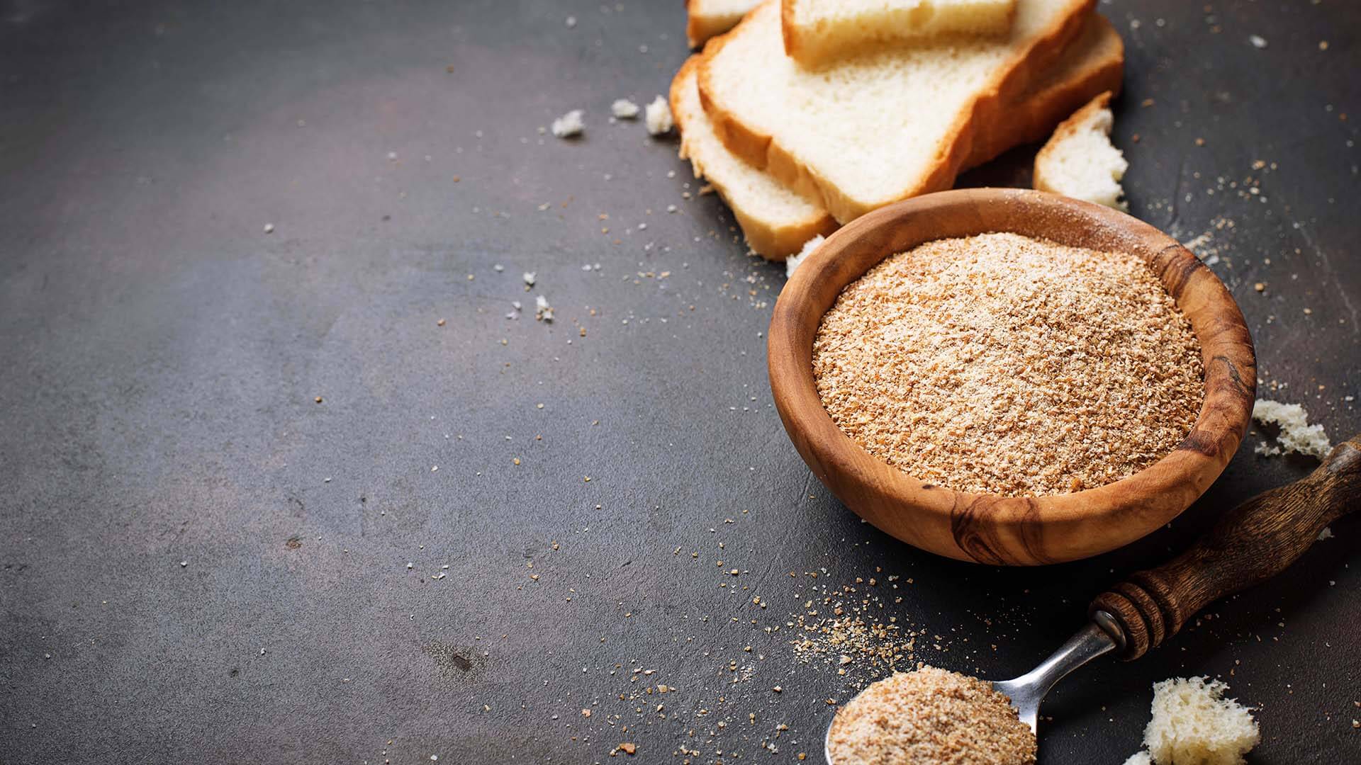 bowl-of-breadcrumbs-and-slices-of-a-loaf