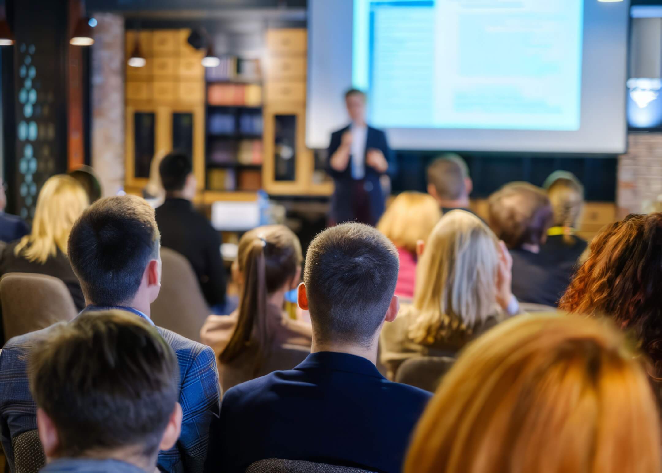 business lawyer giving a talk at seminar on conference hall