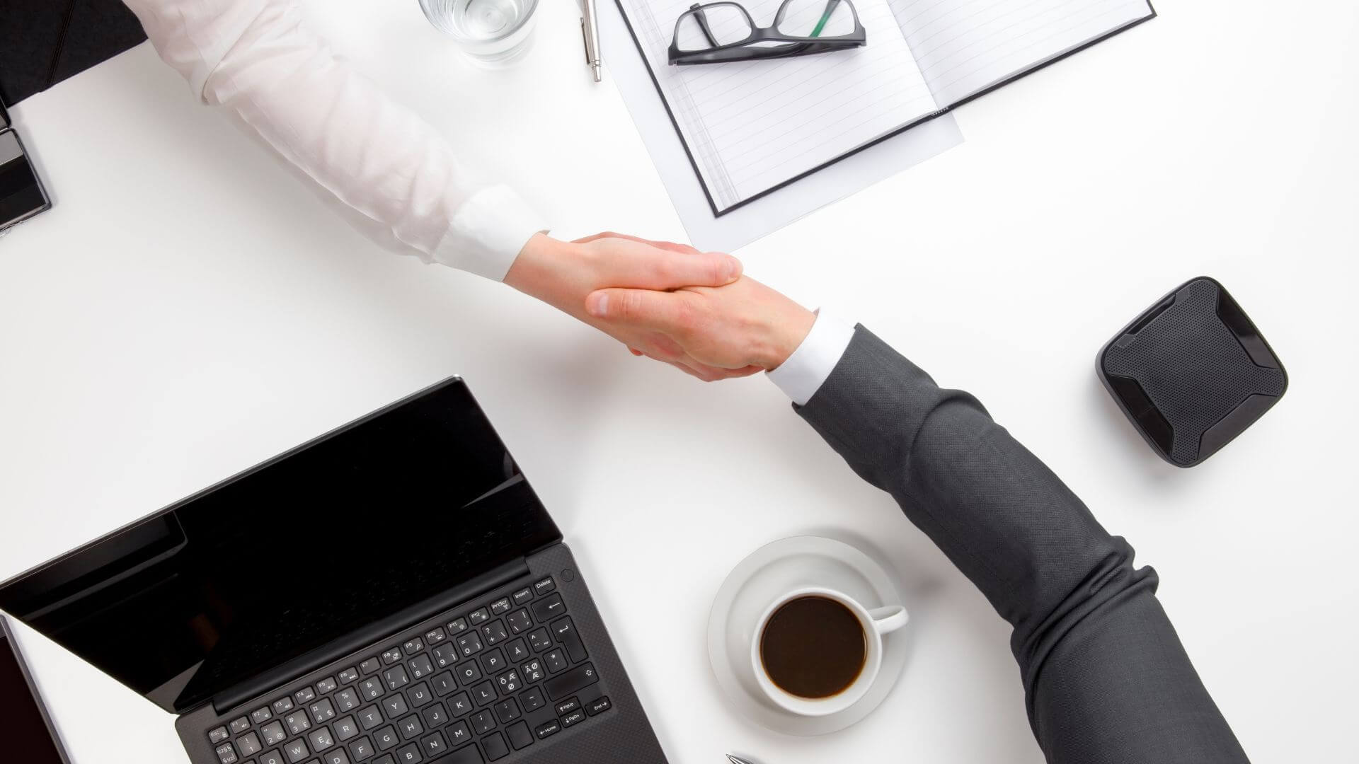 business people shaking hands over a meeting