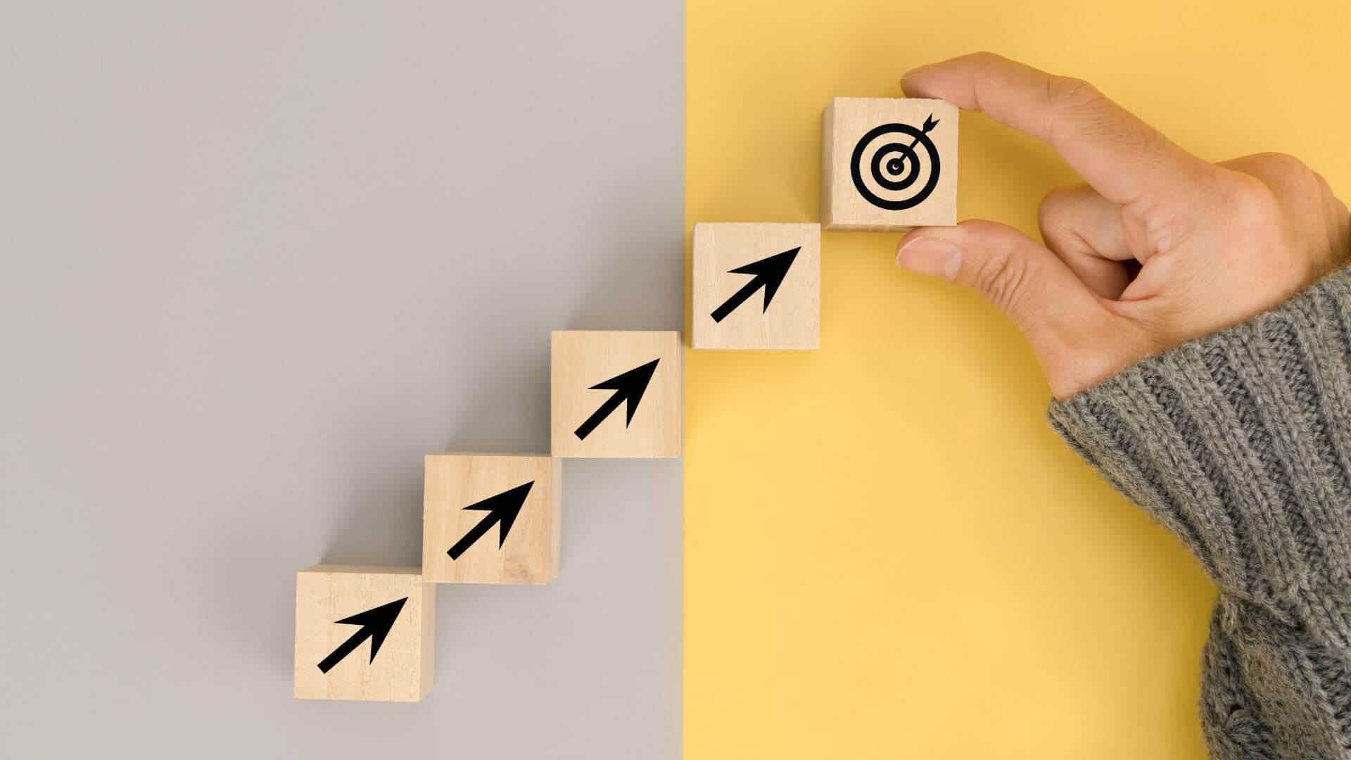 businessman arranging wood block with business strategy icon