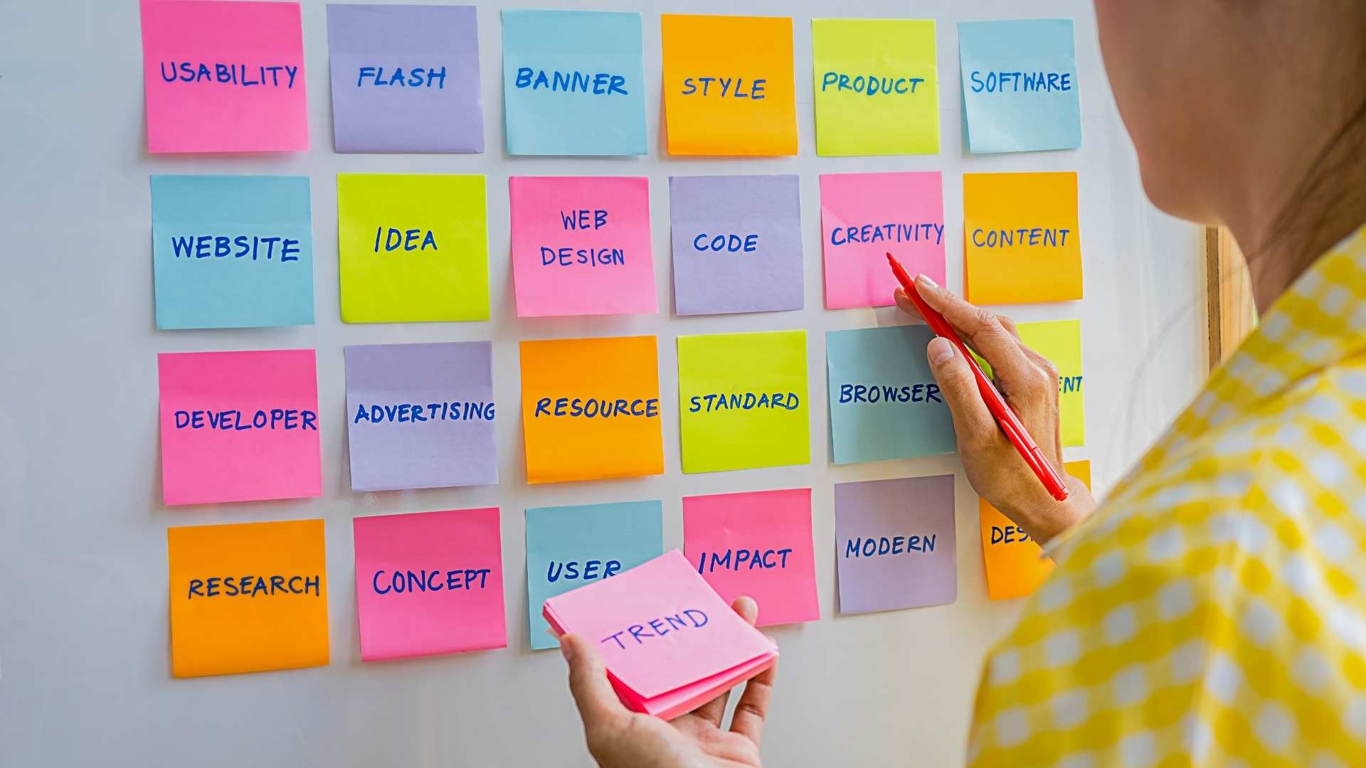 creative designer planning and brainstorming with sticky notes