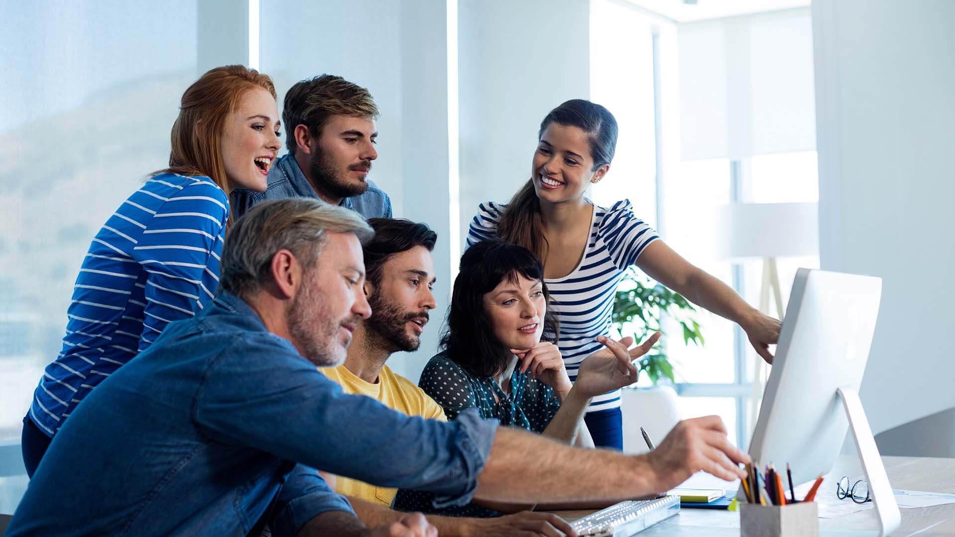 creative-business-team-discussing-while-working