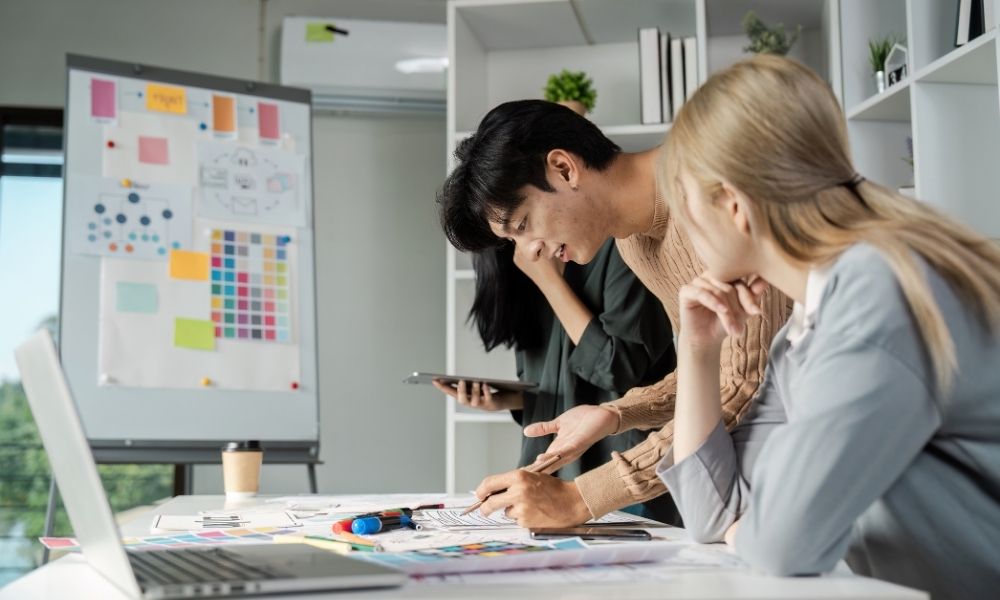 creative team collaborating in UXUI design inside a modern studio