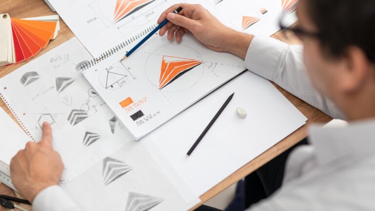 designer designing logo manually