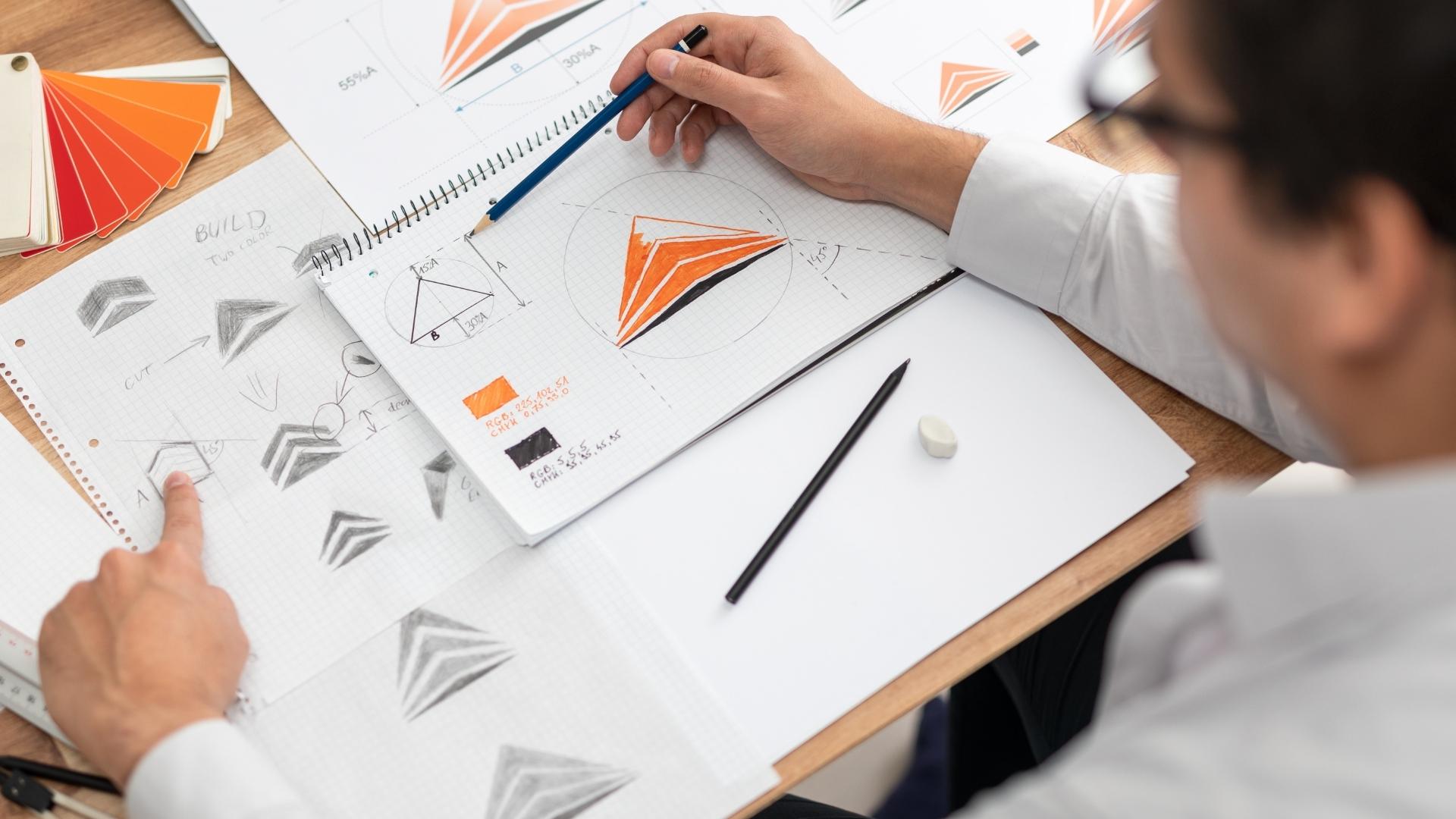 designer designing logo manually