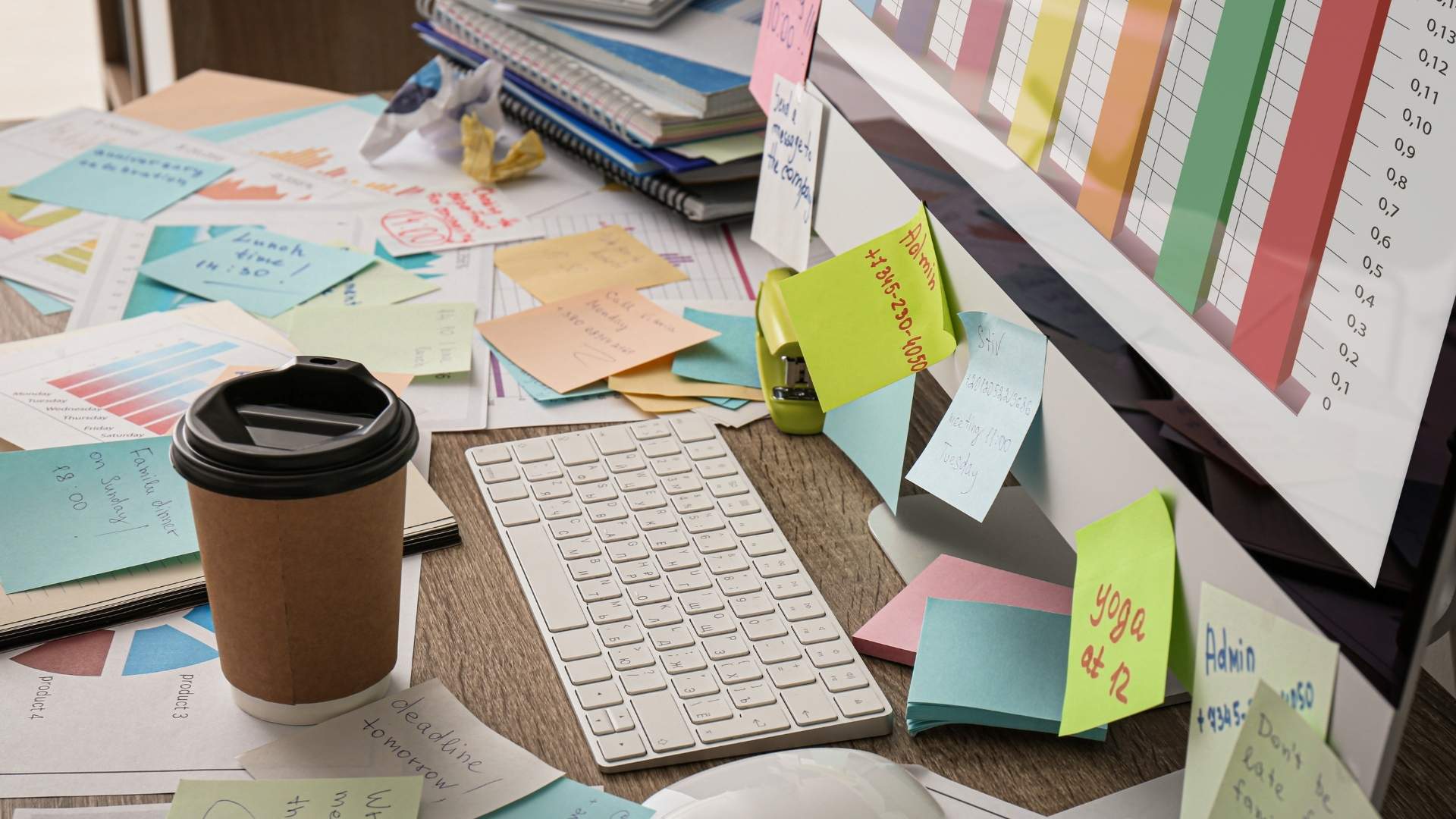 desk full of notes and paper work