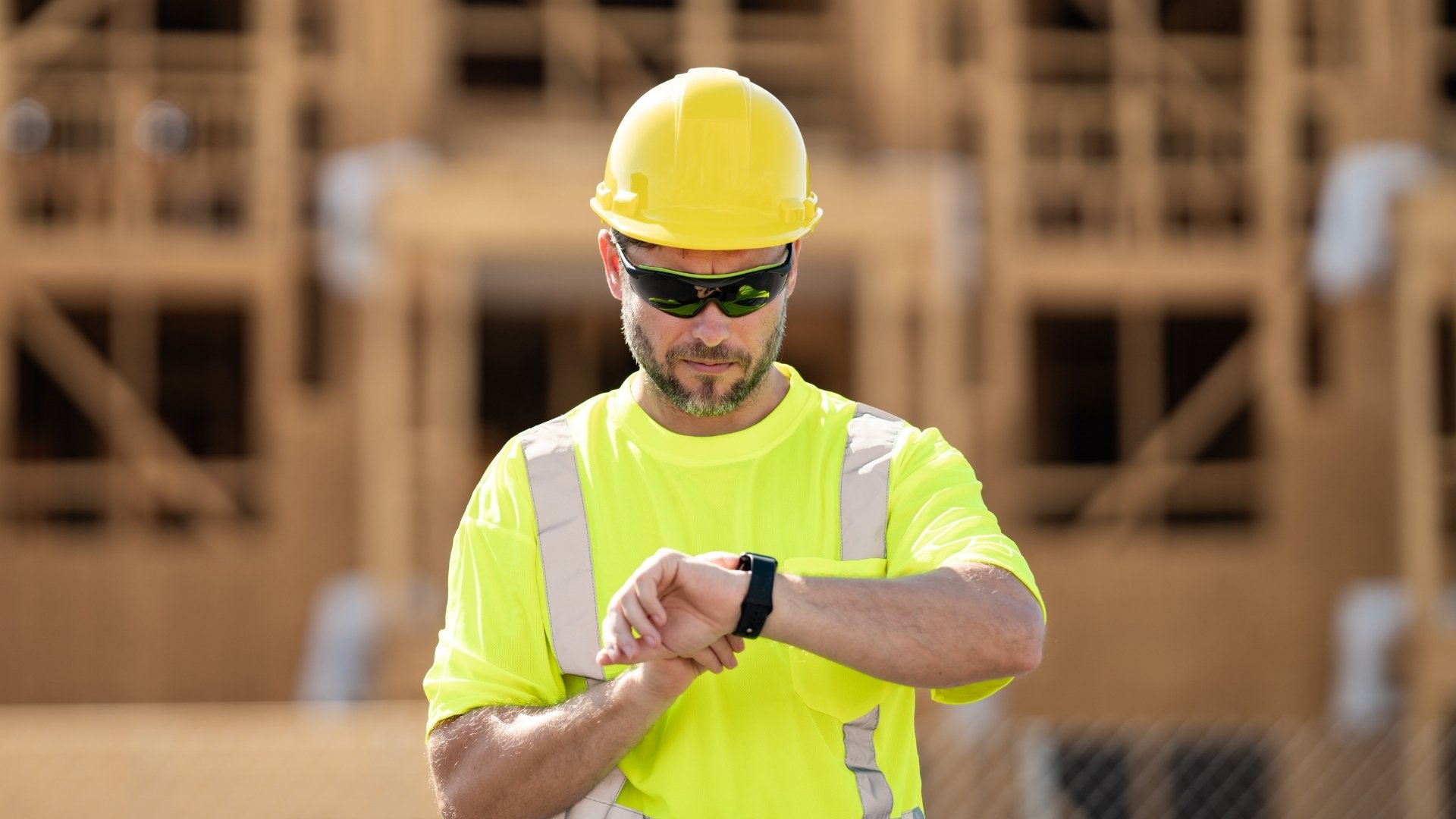 engineer checking his watch