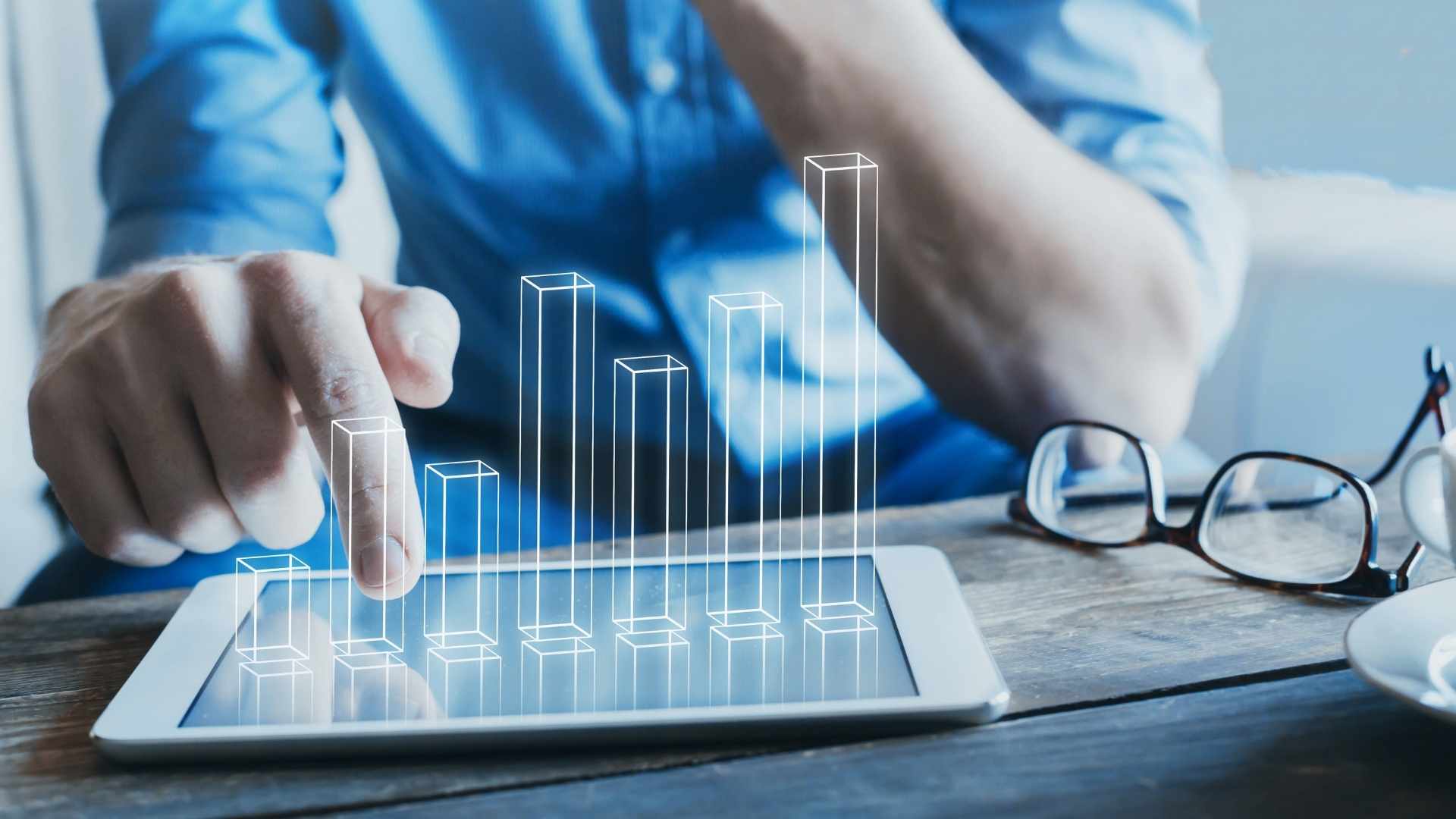 entrepreneur using digital technology for business with 3d column chart