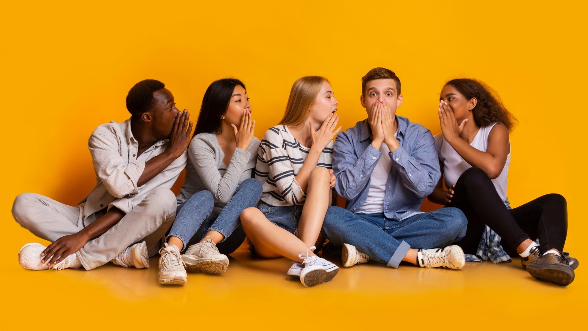 friends gossiping in yellow background