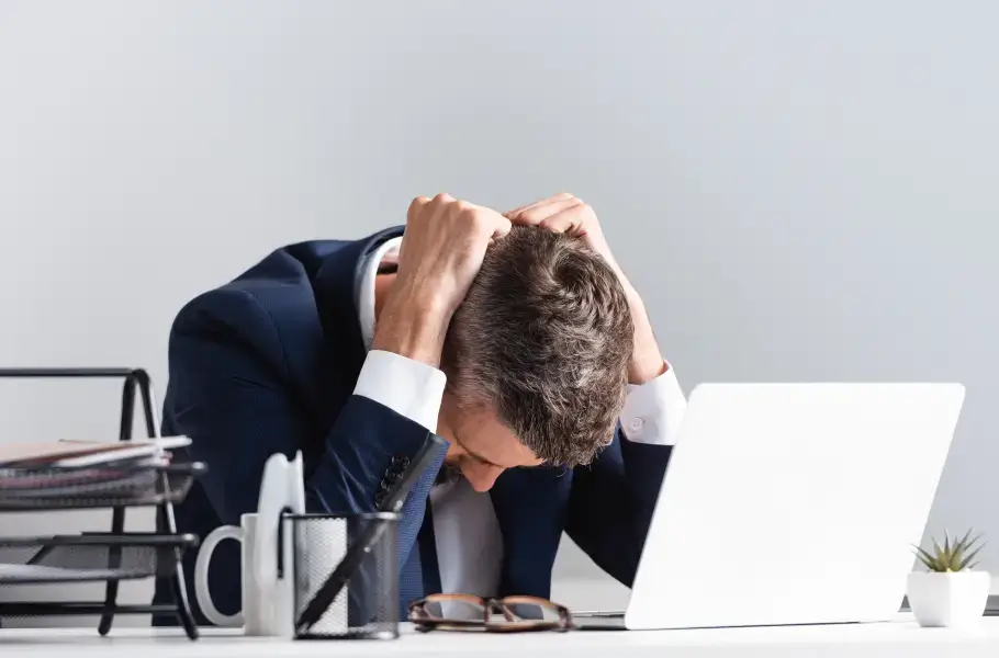 Frustrated man with laptop