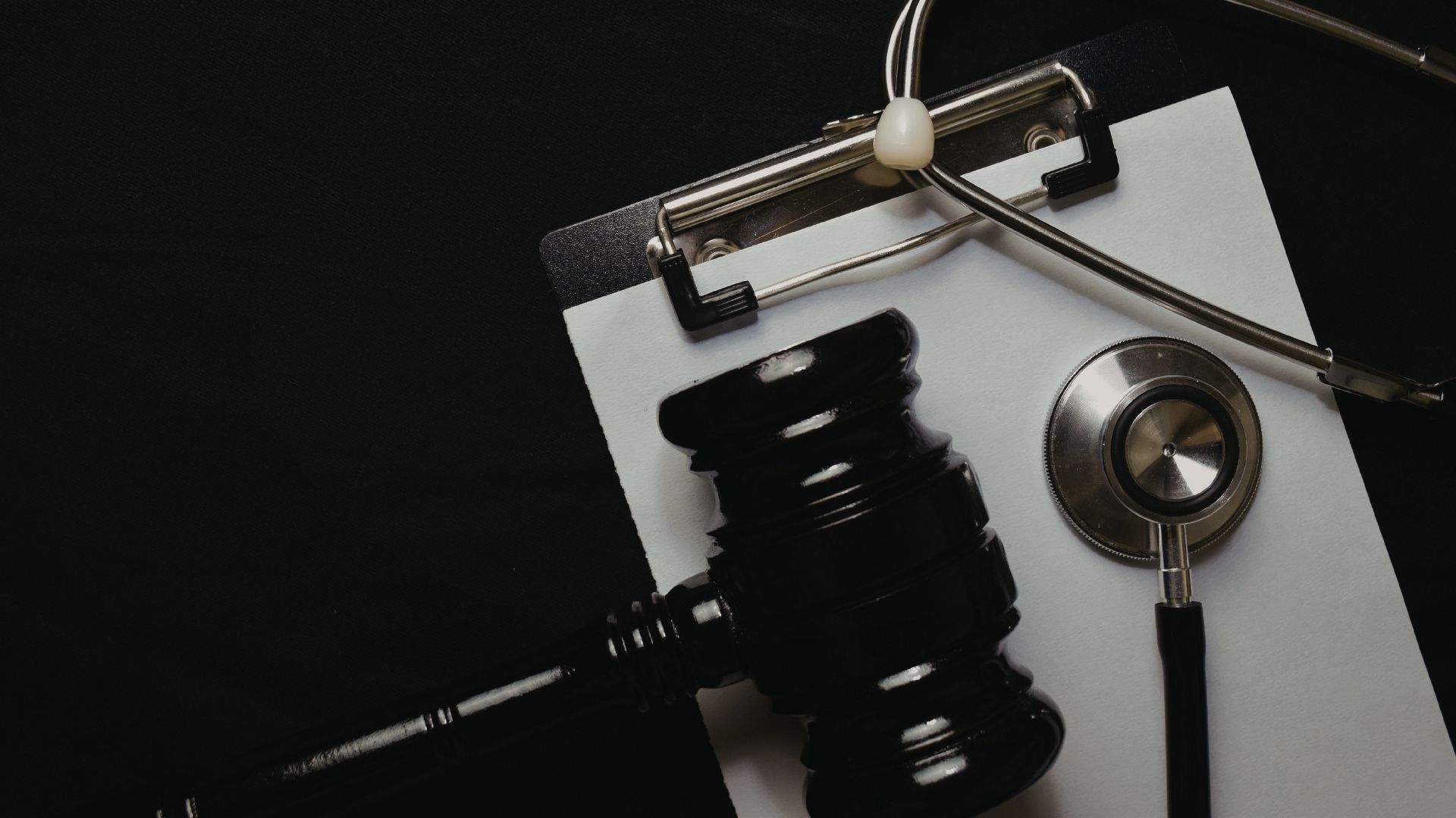 gavel and stethoscope beside each other