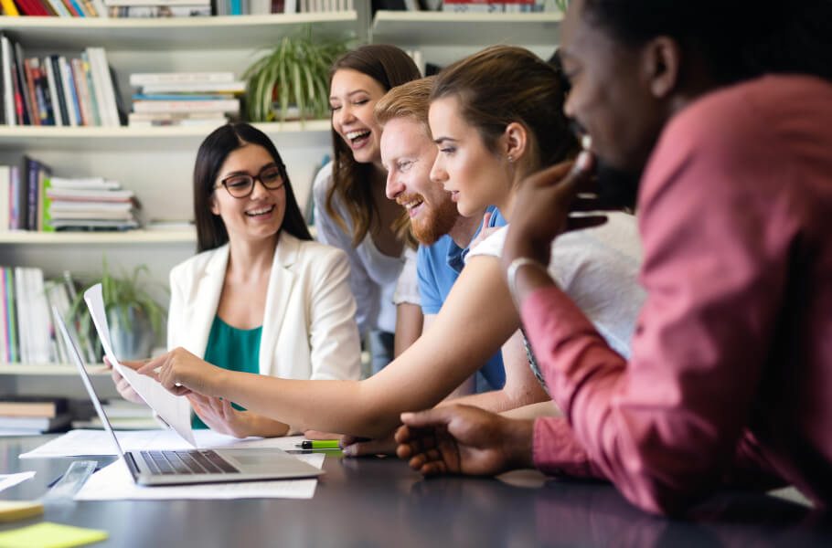 group of social media experts happily discussing their strategy