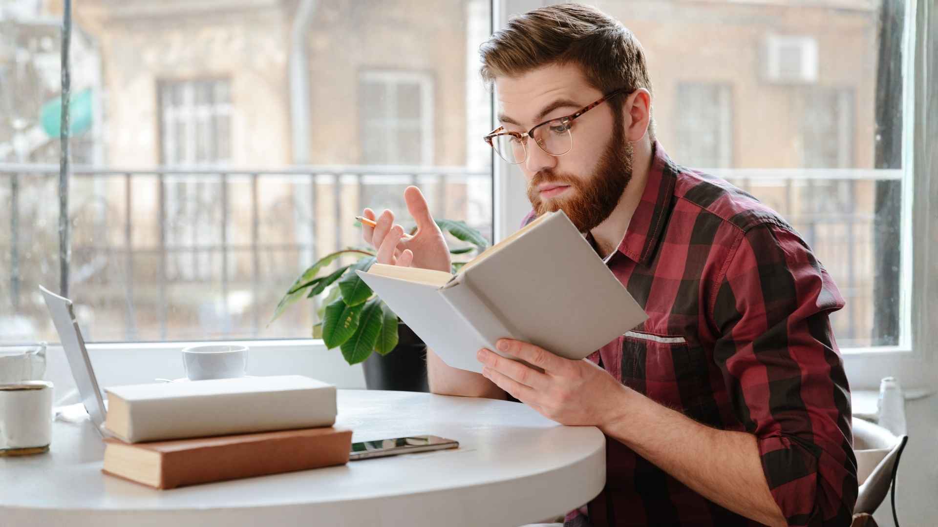 guy reading the rulebook on website planning