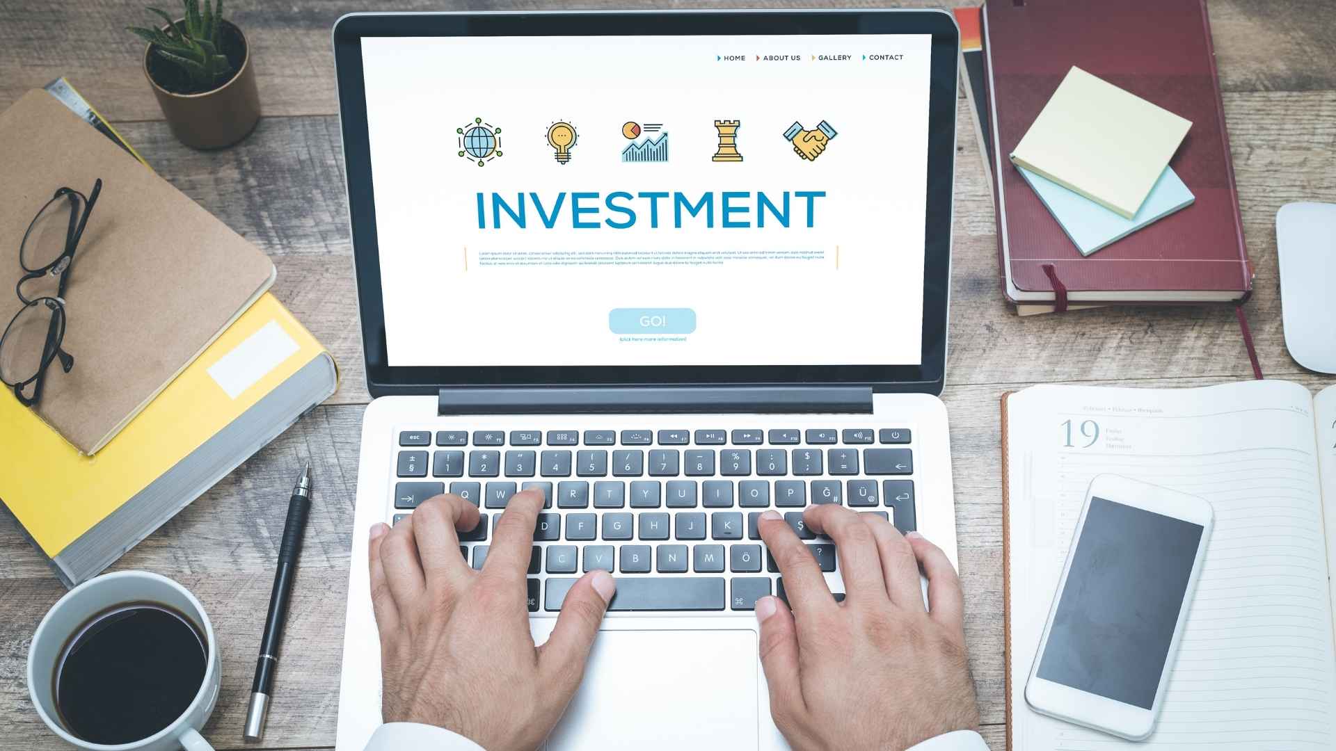 guy working on his investment plan on a laptop