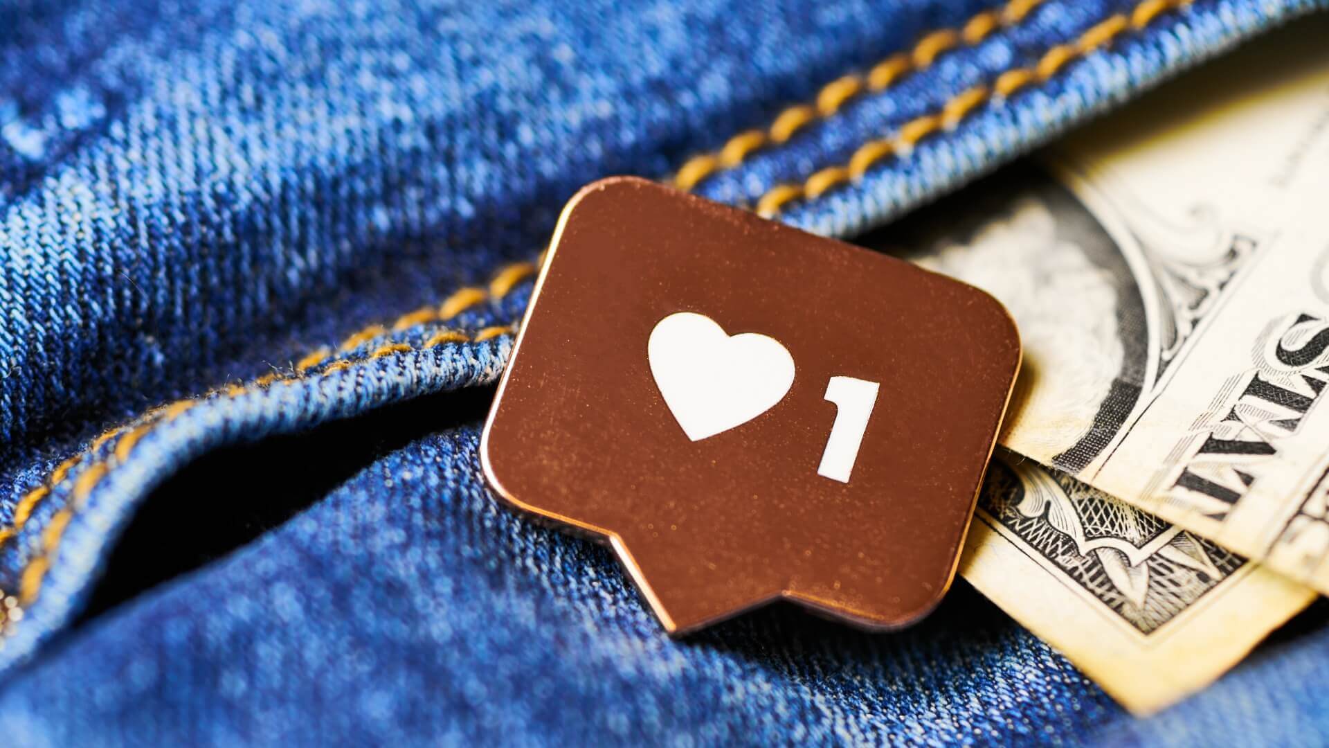 heart symbol and dollars on top of jeans