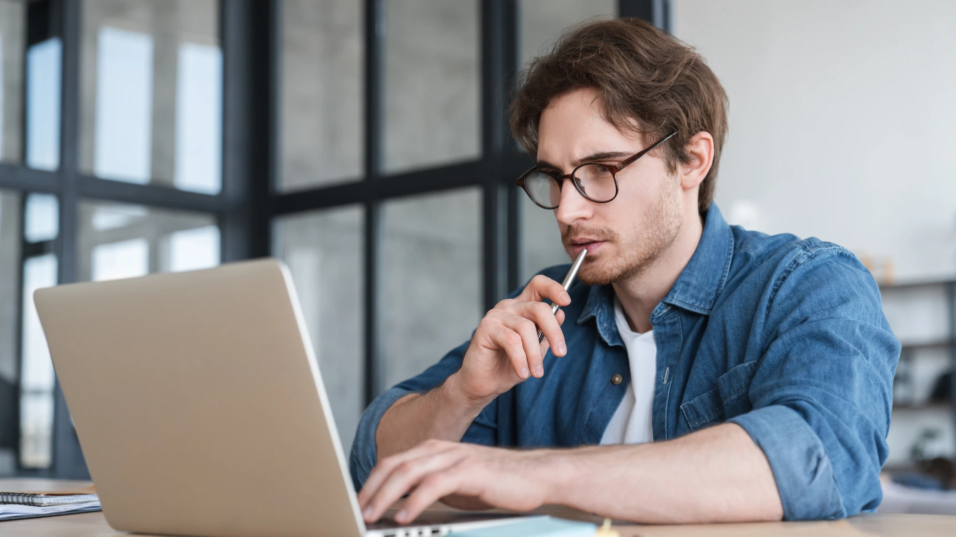 Intelligent thoughtful pensive young smart business