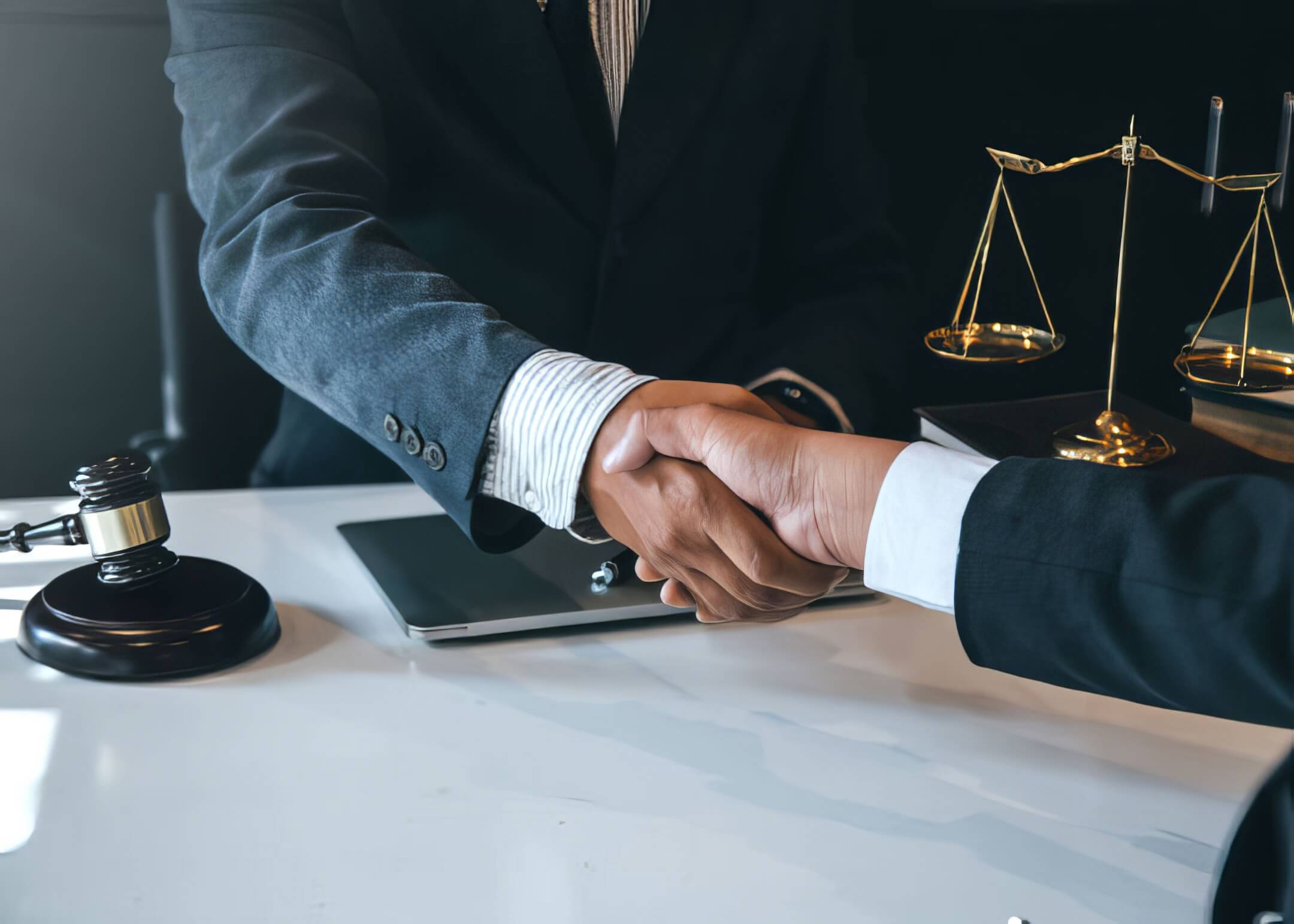 lawyer shaking hands with his new client