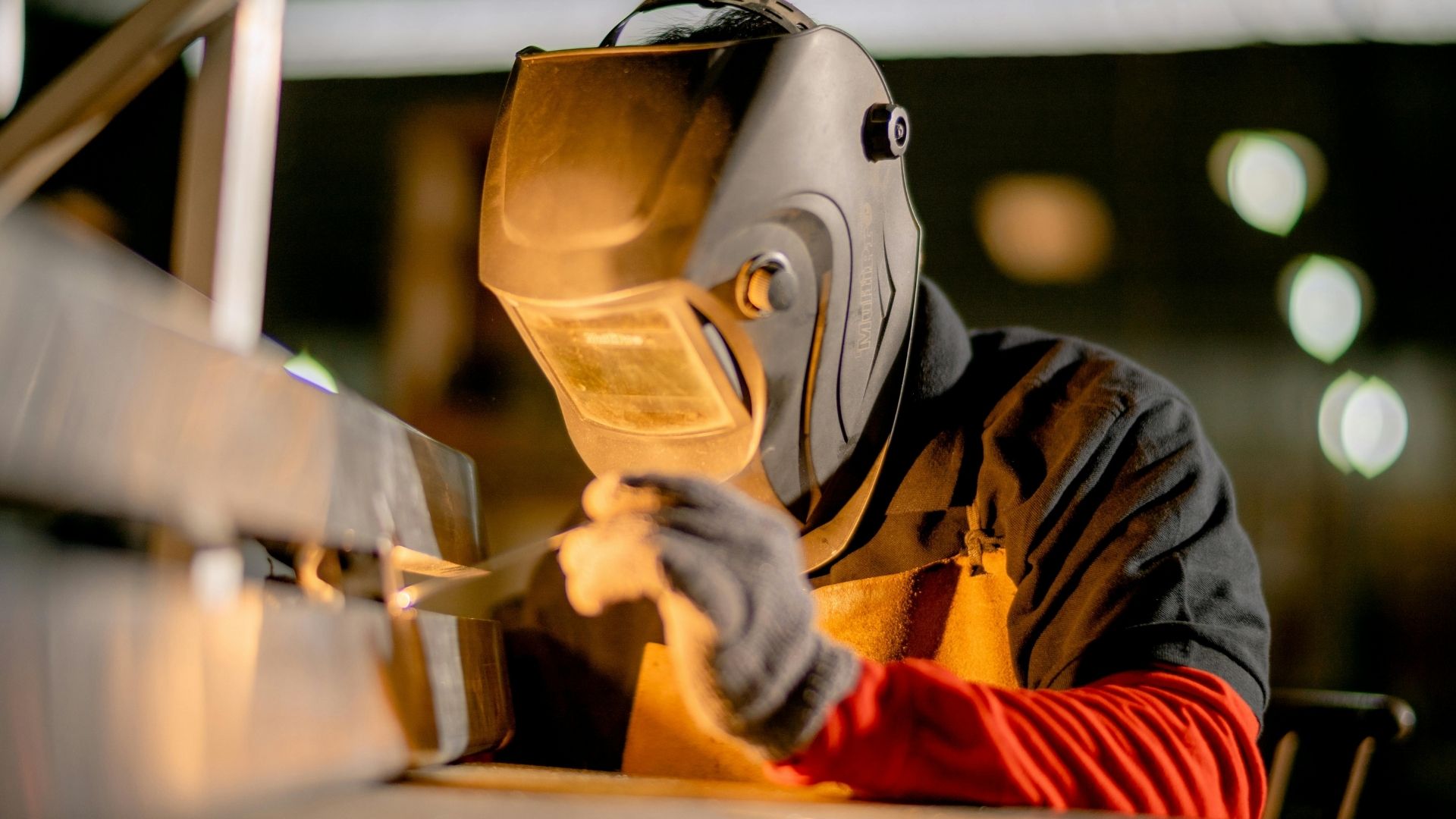man doing welding works with ppe