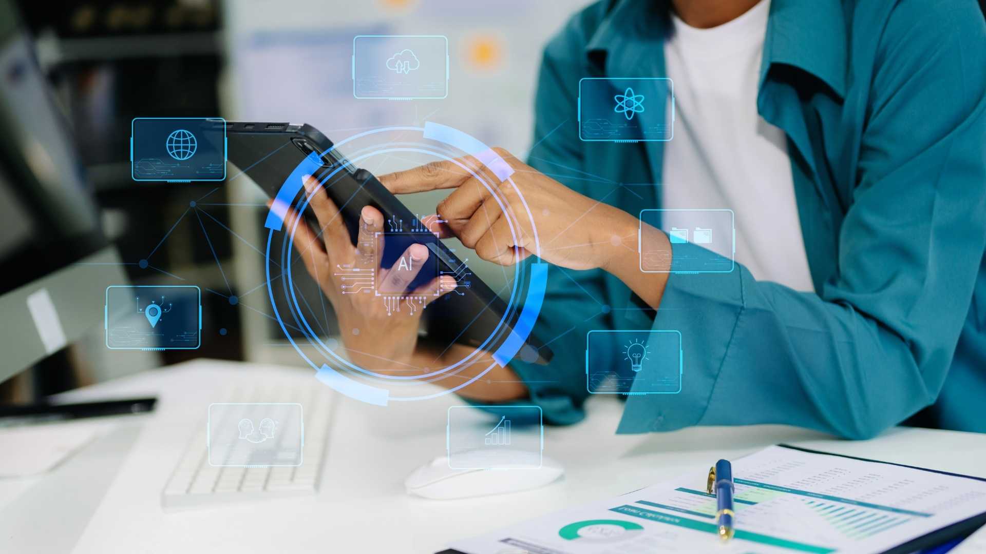 man using his tablet to run AI for work completion